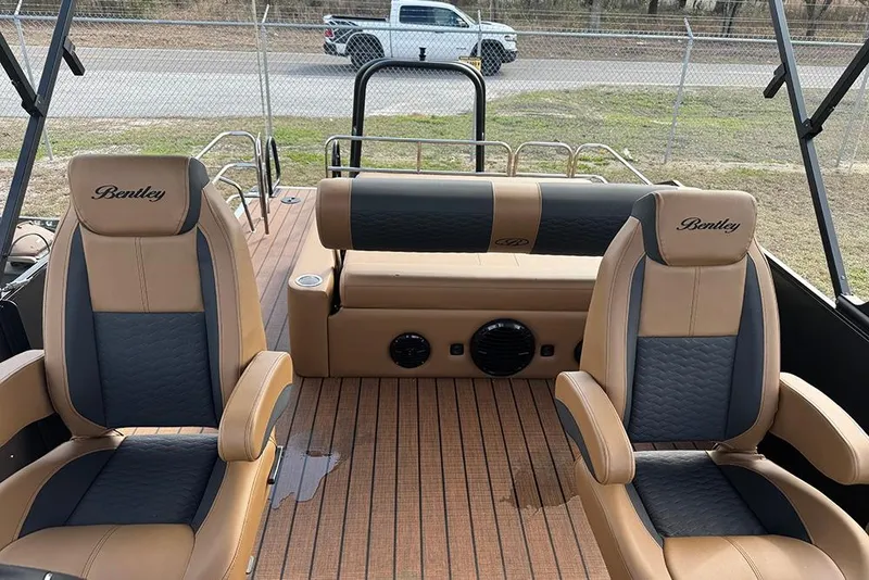 Slide: The Image of 2026 Bentley Pontoons Elite 253 interior with dual captain seats and luxury design. - 24