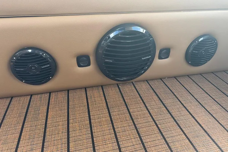 Slide: The Image of 2026 Bentley Pontoons Elite 253 interior speakers on stylish striped flooring. - 25