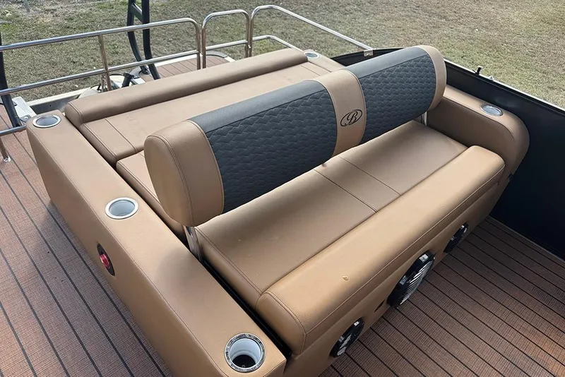 Slide: The Image of 2026 Bentley Pontoons Elite 253 Swingback Dual Captain Full Tritoon seating area with cup holders. - 27
