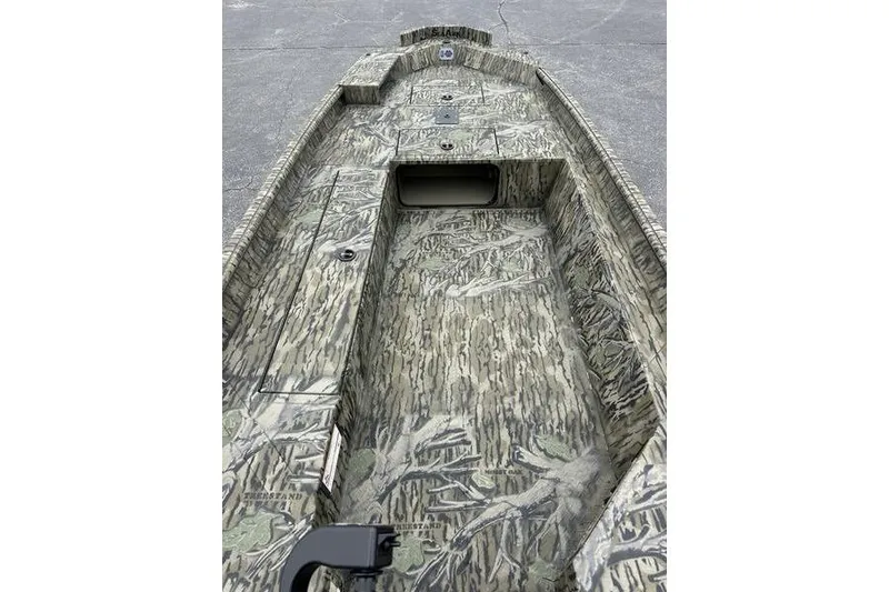 Slide: The Image of 2026 SeaArk 1752 Slayer X boat interior with camouflage design, featuring storage compartments. - 5