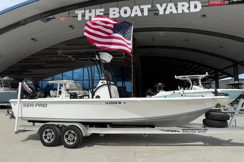 The Image of 2018 Sea Pro 228 Bay boat on trailer with American flag at The Boat Yard. - 1