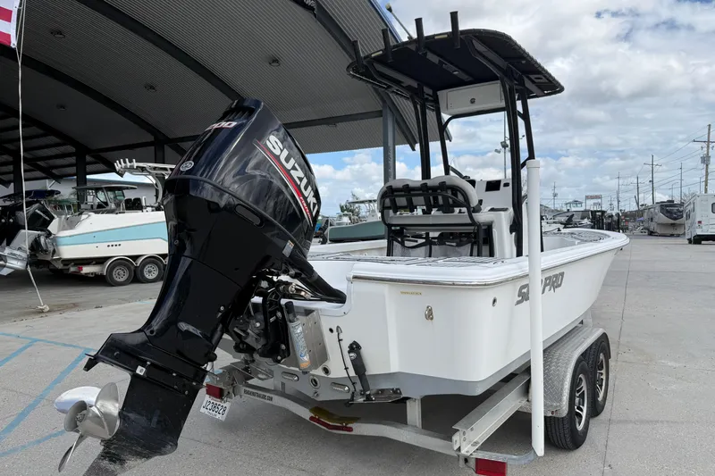 Slide: The Image of 2018 Sea Pro 228 Bay boat with Suzuki outboard motor on a trailer. - 3