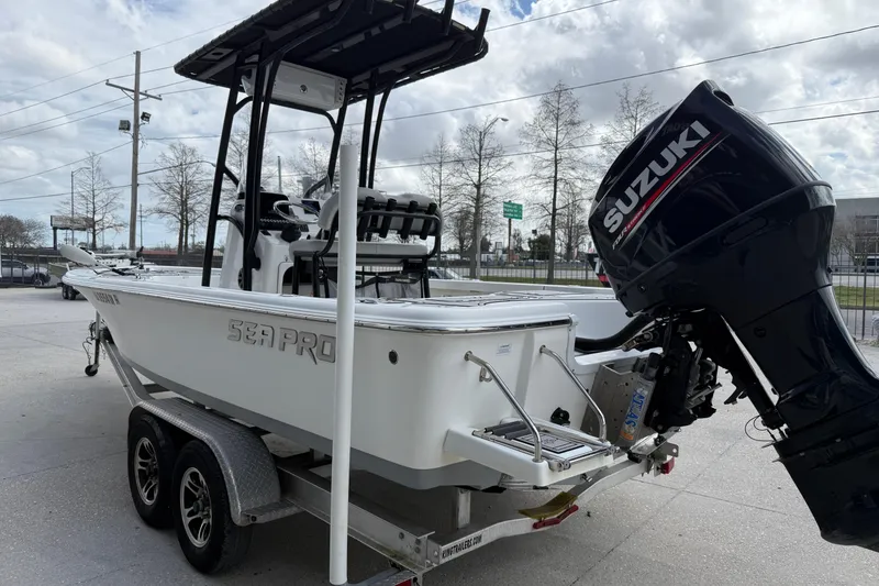 Slide: The Image of 2018 Sea Pro 228 Bay boat with Suzuki outboard motor on a trailer. - 4