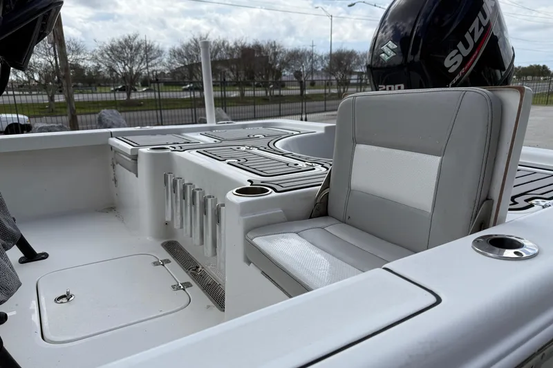 Slide: The Image of 2018 Sea Pro 228 Bay boat interior with seating and Suzuki engine. - 7