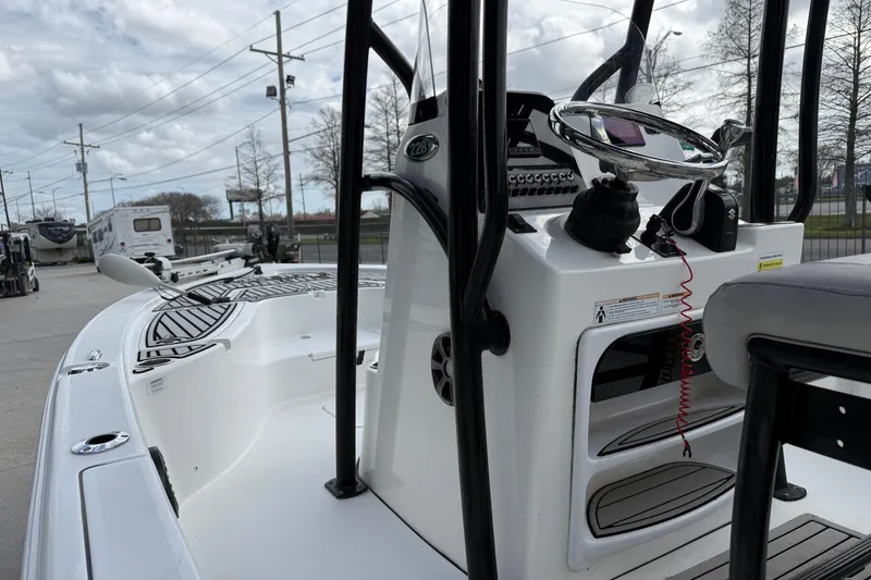 Slide: The Image of 2018 Sea Pro 228 Bay boat with steering console, parked outdoors. - 8