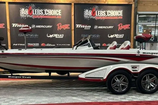 The Image of 2021 Ranger Z521L boat displayed at Anglers Choice event, featuring sleek design and dual-axle trailer. - 1