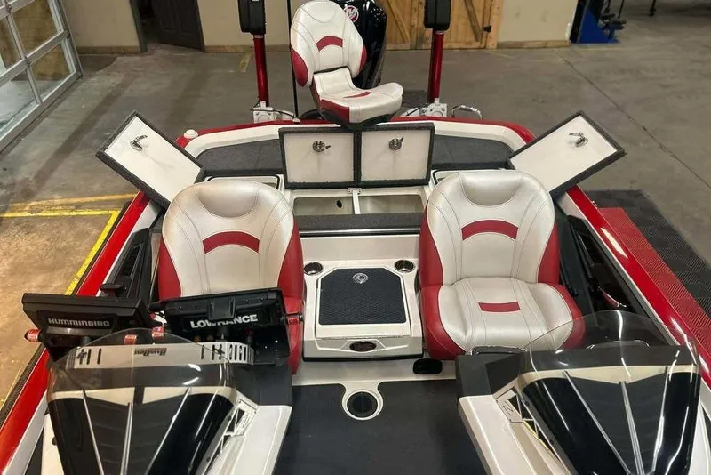 Slide: The Image of 2021 Ranger Z521L boat interior with red and white seats, storage compartments, and navigation equipment. - 10