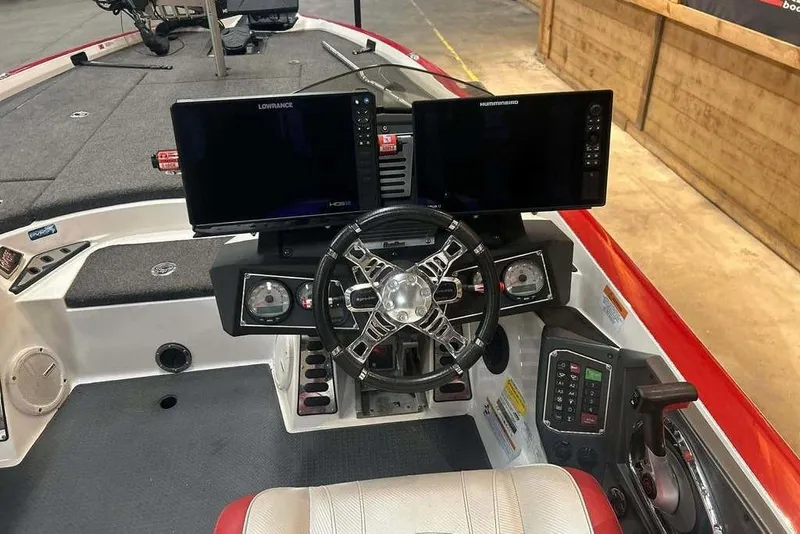 Slide: The Image of 2021 Ranger Z521L boat cockpit with dual screens and modern steering wheel. - 8
