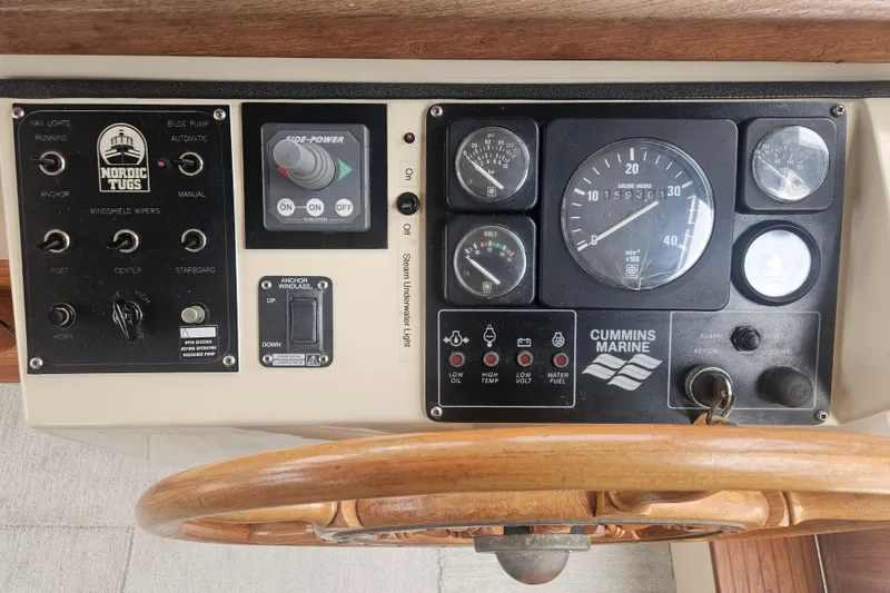 Slide: The Image of Control panel of a 1998 Nordic Tug 32 boat with Cummins Marine gauges. - 23