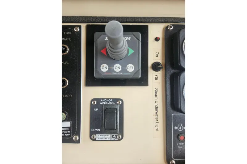 Slide: The Image of Control panel of a 1998 Nordic Tug 32 with thruster and anchor windlass switches. - 24