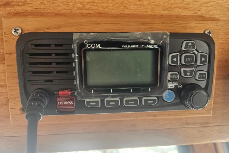 Slide: The Image of VHF marine radio on 1998 Nordic Tug 32, featuring distress button and control panel. - 28