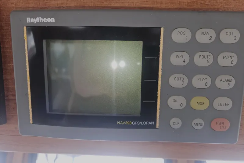 Slide: The Image of Raytheon NAV398 GPS/LORAN system on 1998 Nordic Tug 32 boat dashboard. - 29