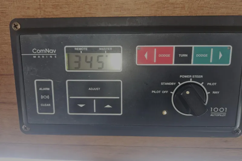 Slide: The Image of ComNav Marine autopilot control panel on 1998 Nordic Tug 32 boat. - 30