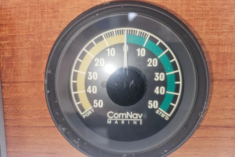 Slide: The Image of ComNav Marine gauge on 1998 Nordic Tug 32, displaying port and starboard angles. - 33