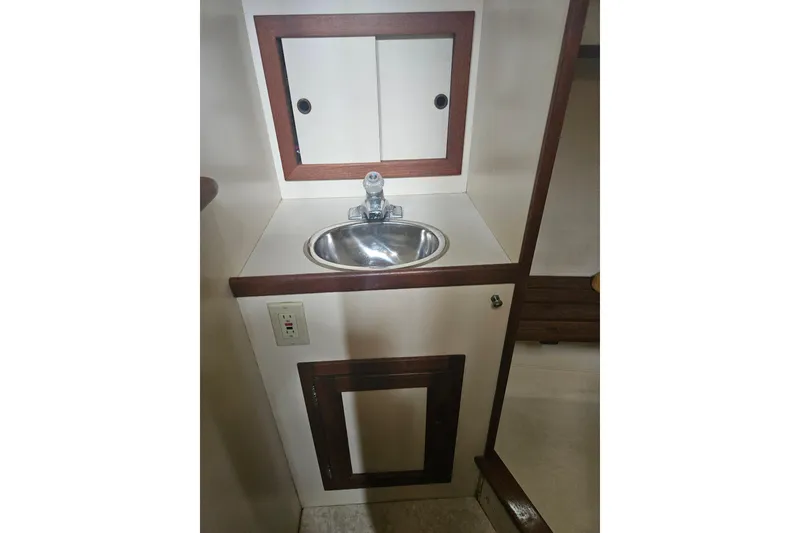 Slide: The Image of Compact sink area in 1998 Nordic Tug 32 boat interior. - 39
