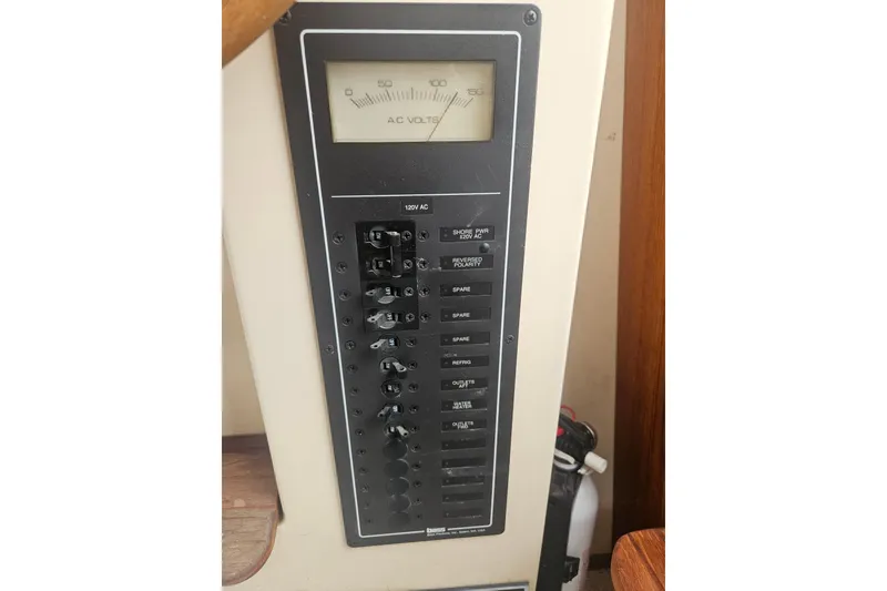 Slide: The Image of Electrical panel on a 1998 Nordic Tug 32 boat, displaying AC voltage meter. - 42