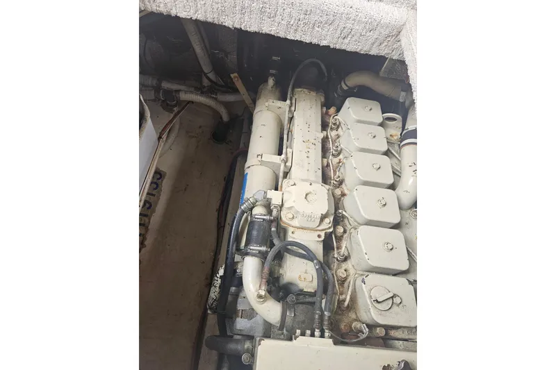 Slide: The Image of Engine compartment of a 1998 Nordic Tug 32 boat, showcasing mechanical components. - 47