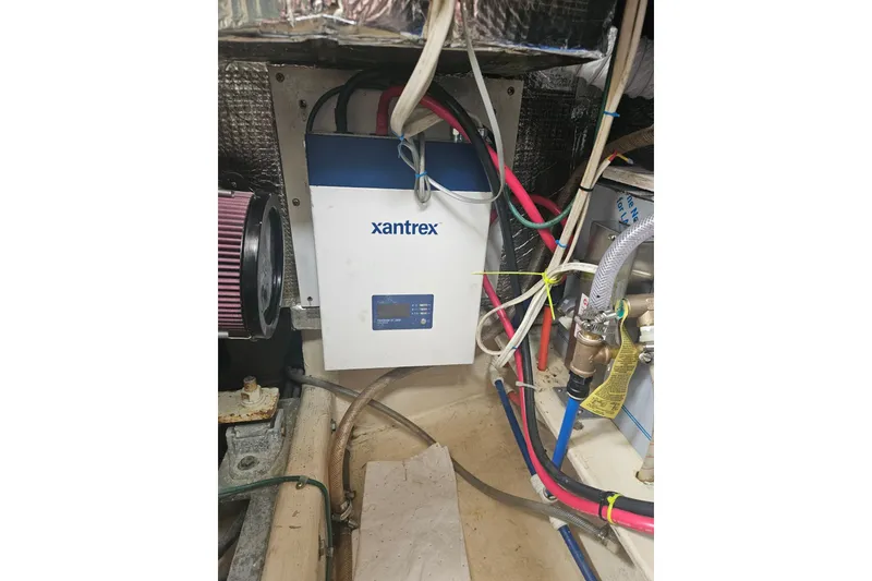 Slide: The Image of Electrical system inside 1998 Nordic Tug 32, featuring Xantrex inverter and wiring. - 51