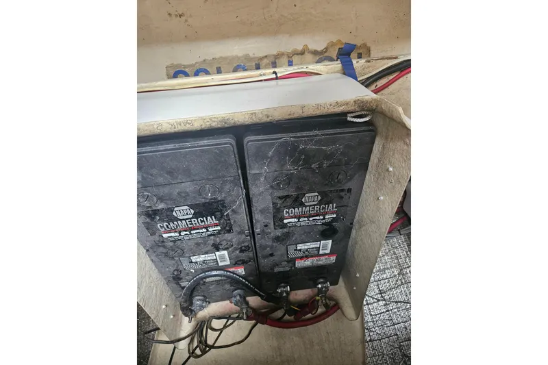 Slide: The Image of Two NAPA commercial batteries in a 1998 Nordic Tug 32 boat. - 53