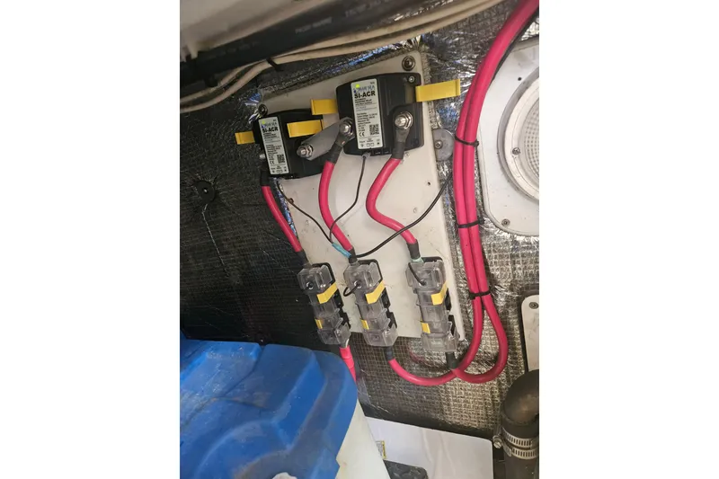 Slide: The Image of Electrical panel with wiring inside a 1998 Nordic Tug 32 boat. - 56