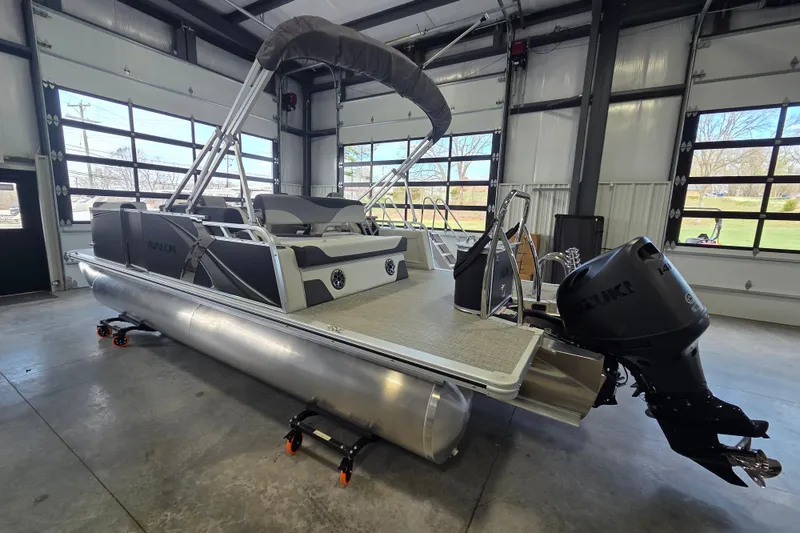 Slide: The Image of 2026 Avalon LSZ 2185 Cruise Rear Bench pontoon boat in a showroom. - 4