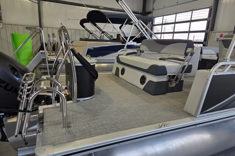 Slide: The Image of 2026 Avalon LSZ 2185 Cruise Rear Bench pontoon boat interior in showroom. - 5