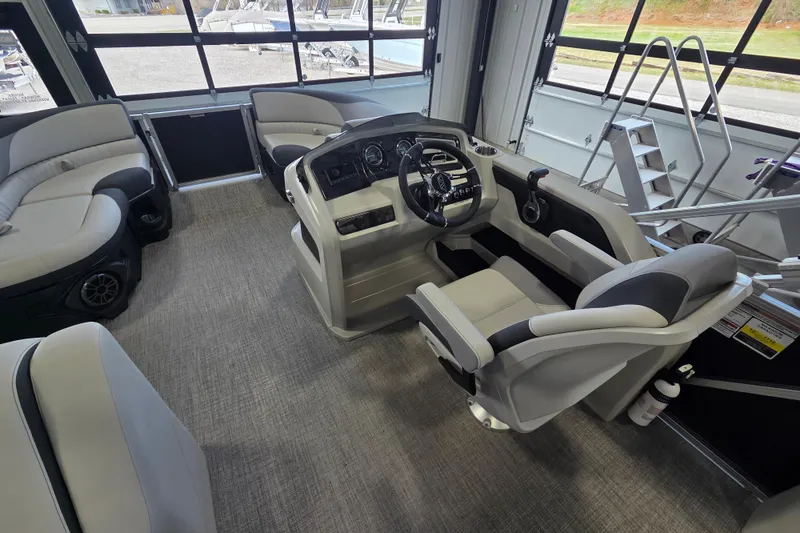 Slide: The Image of Interior of 2026 Avalon LSZ 2185 Cruise Rear Bench boat, featuring modern helm and seating. - 8