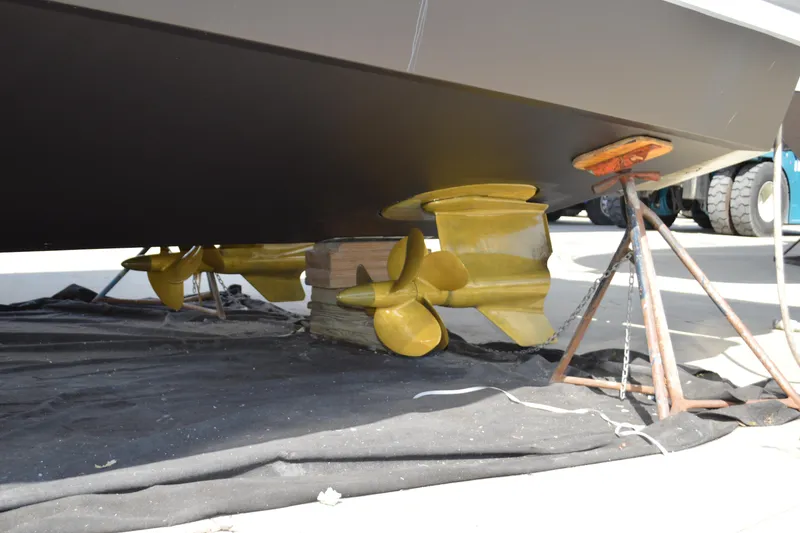 Slide: The Image of Underneath view of 2017 Tiara Yachts C44 Coupe with visible propellers and supports. - 10