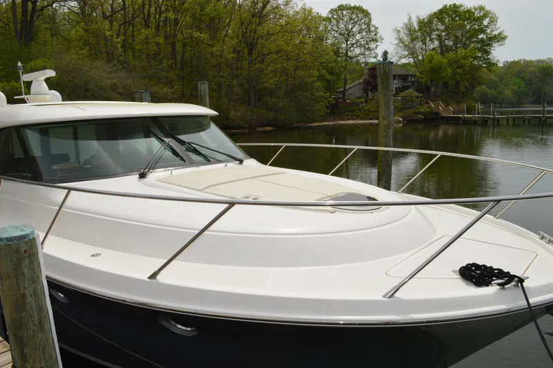 Slide: The Image of 2017 Tiara Yachts C44 Coupe at a serene dock. - 12