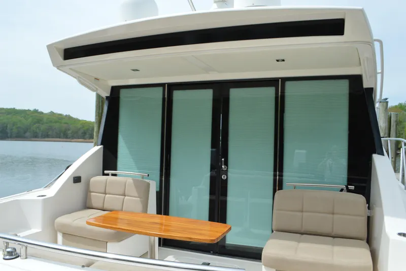 Slide: The Image of 2017 Tiara Yachts C44 Coupe with stylish outdoor seating area. - 18