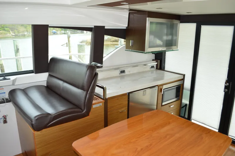 Slide: The Image of Interior of 2017 Tiara Yachts C44 Coupe with modern kitchen. - 25