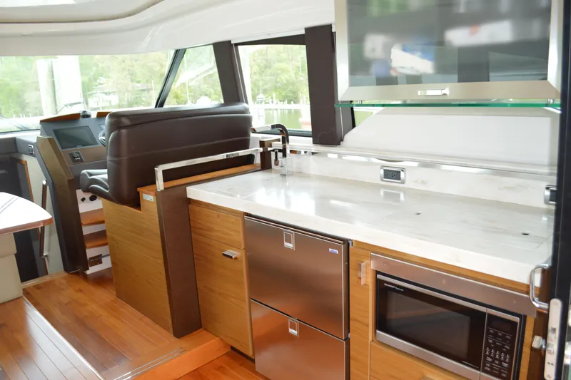 Slide: The Image of Interior of 2017 Tiara Yachts C44 Coupe with modern kitchen. - 26