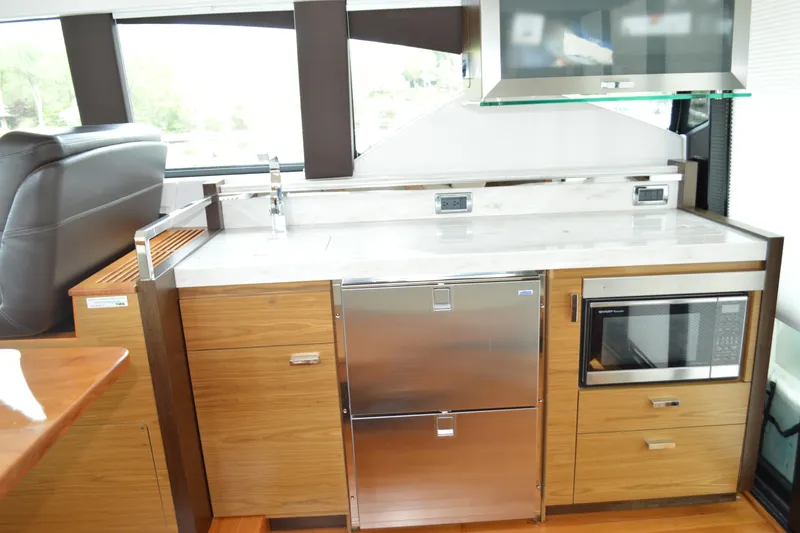 Slide: The Image of Interior of 2017 Tiara Yachts C44 Coupe featuring modern kitchen. - 27