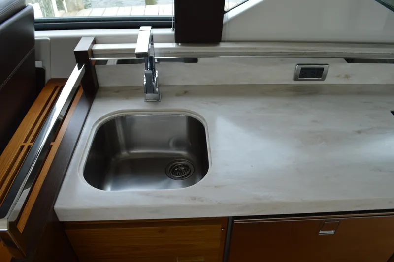 Slide: The Image of Tiara Yachts C44 Coupe 2017 kitchen area with sink. - 30