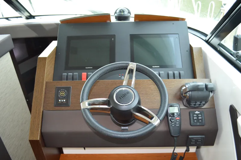 Slide: The Image of 2017 Tiara Yachts C44 Coupe helm with Garmin displays. - 33