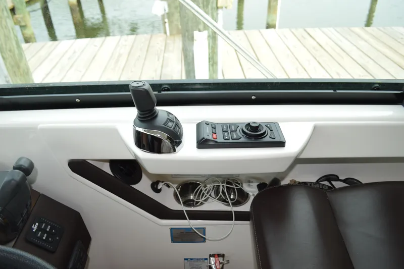 Slide: The Image of 2017 Tiara Yachts C44 Coupe helm with control panel. - 34