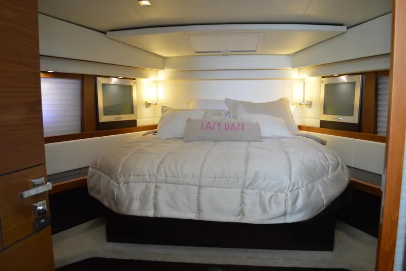 Slide: The Image of Luxurious bedroom interior of 2017 Tiara Yachts C44 Coupe with cozy bedding and ambient lighting. - 39