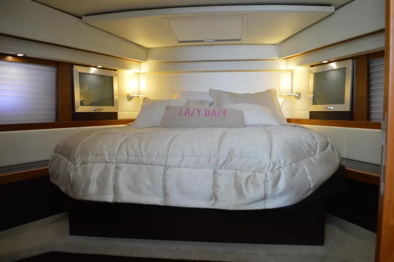 Slide: The Image of Luxurious bedroom interior of 2017 Tiara Yachts C44 Coupe with cozy bedding. - 40