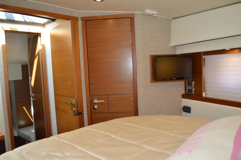 Slide: The Image of Luxurious interior of 2017 Tiara Yachts C44 Coupe with wood finishes and modern amenities. - 42