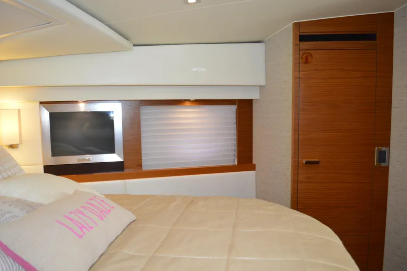 Slide: The Image of Interior of 2017 Tiara Yachts C44 Coupe, featuring a cozy bedroom with modern design. - 43