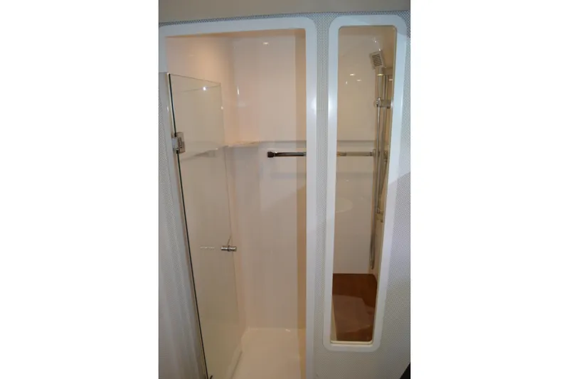 Slide: The Image of Shower area in 2017 Tiara Yachts C44 Coupe, featuring sleek glass door and modern fixtures. - 47