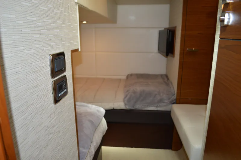 Slide: The Image of Interior cabin of 2017 Tiara Yachts C44 Coupe with twin beds and modern decor. - 51