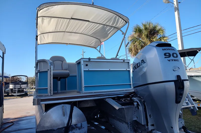Slide: The Image of 2019 South Bay S222FCR pontoon boat with Honda 90 VTEC engine, blue and white design. - 11
