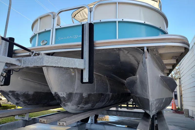 Slide: The Image of 2019 South Bay S222FCR pontoon boat on trailer, viewed from below. - 12