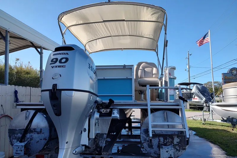 Slide: The Image of 2019 South Bay S222FCR pontoon boat with Honda 90 VTEC engine, parked outdoors. - 13