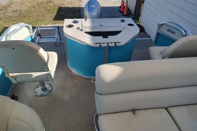 Slide: The Image of 2019 South Bay S222FCR pontoon boat interior with seating and helm station. - 6