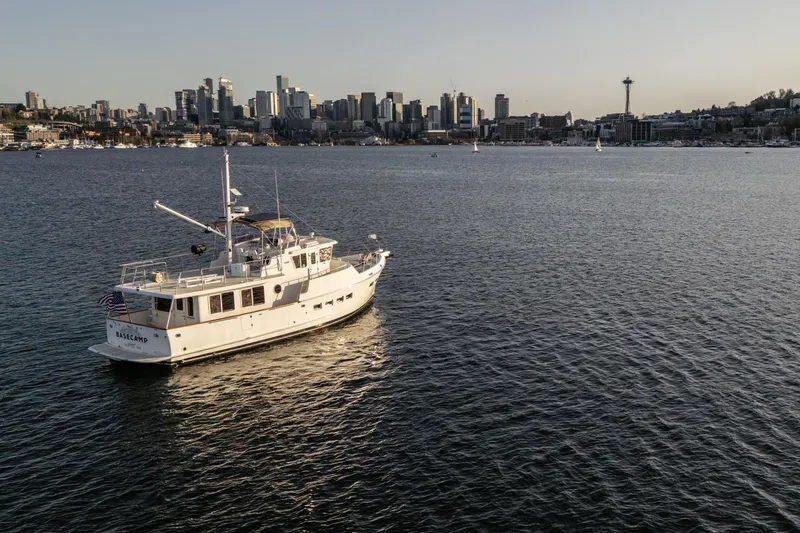 Slide: The Image of Selene 47 yacht on water with city skyline and Space Needle in background, 2003 model. - 4