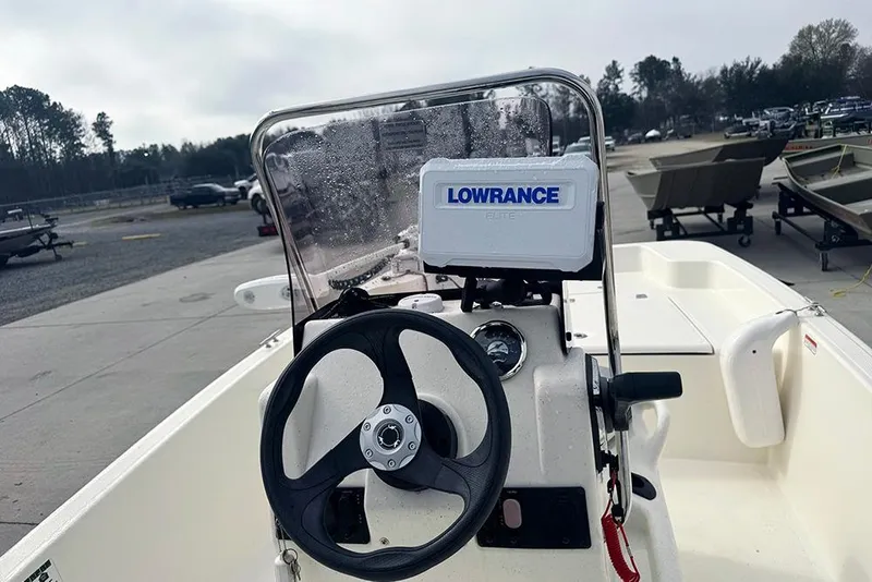 Slide: The Image of 2020 Mako Pro Skiff 15 CC boat with Lowrance navigation system. - 15