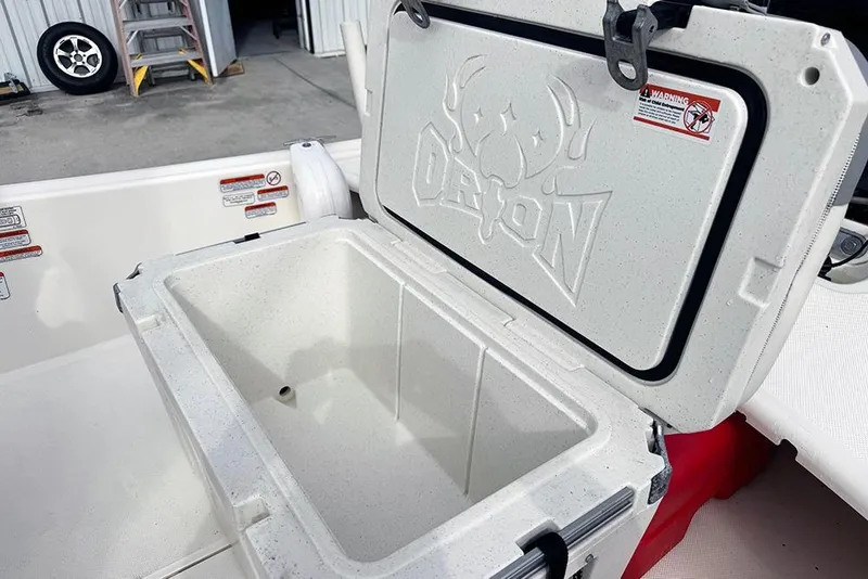 Slide: The Image of Open cooler on 2020 Mako Pro Skiff 15 CC boat deck, showcasing storage space. - 18