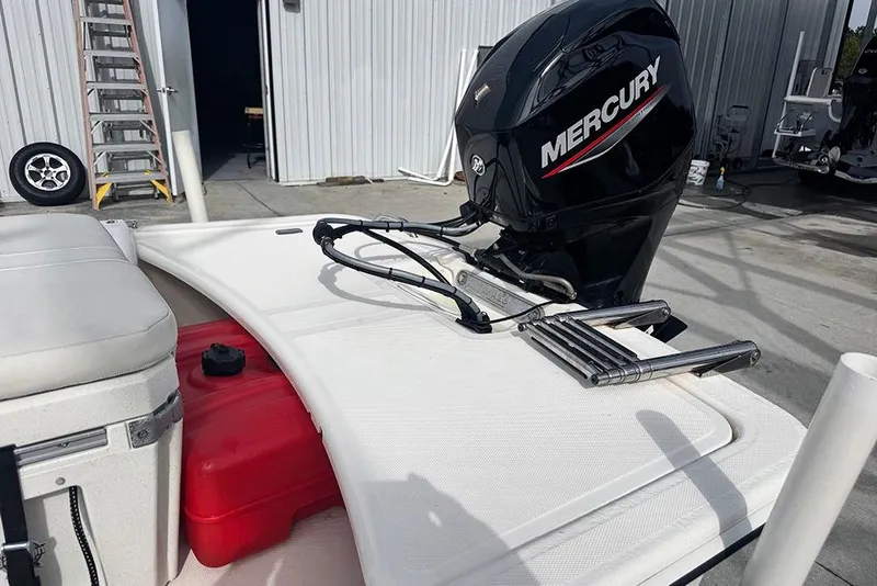Slide: The Image of 2020 Mako Pro Skiff 15 CC with Mercury outboard motor in a boatyard. - 20